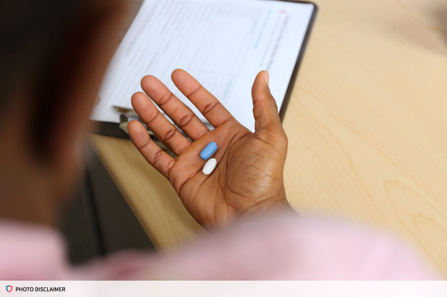 Two pills in the palm of a hand
